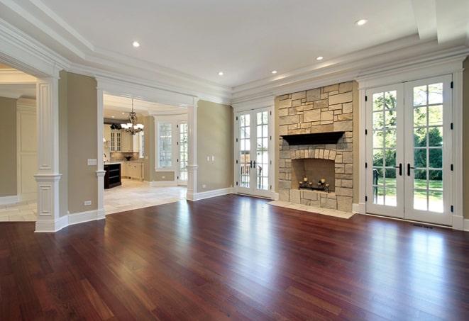 home gym featuring durable hardwood floors